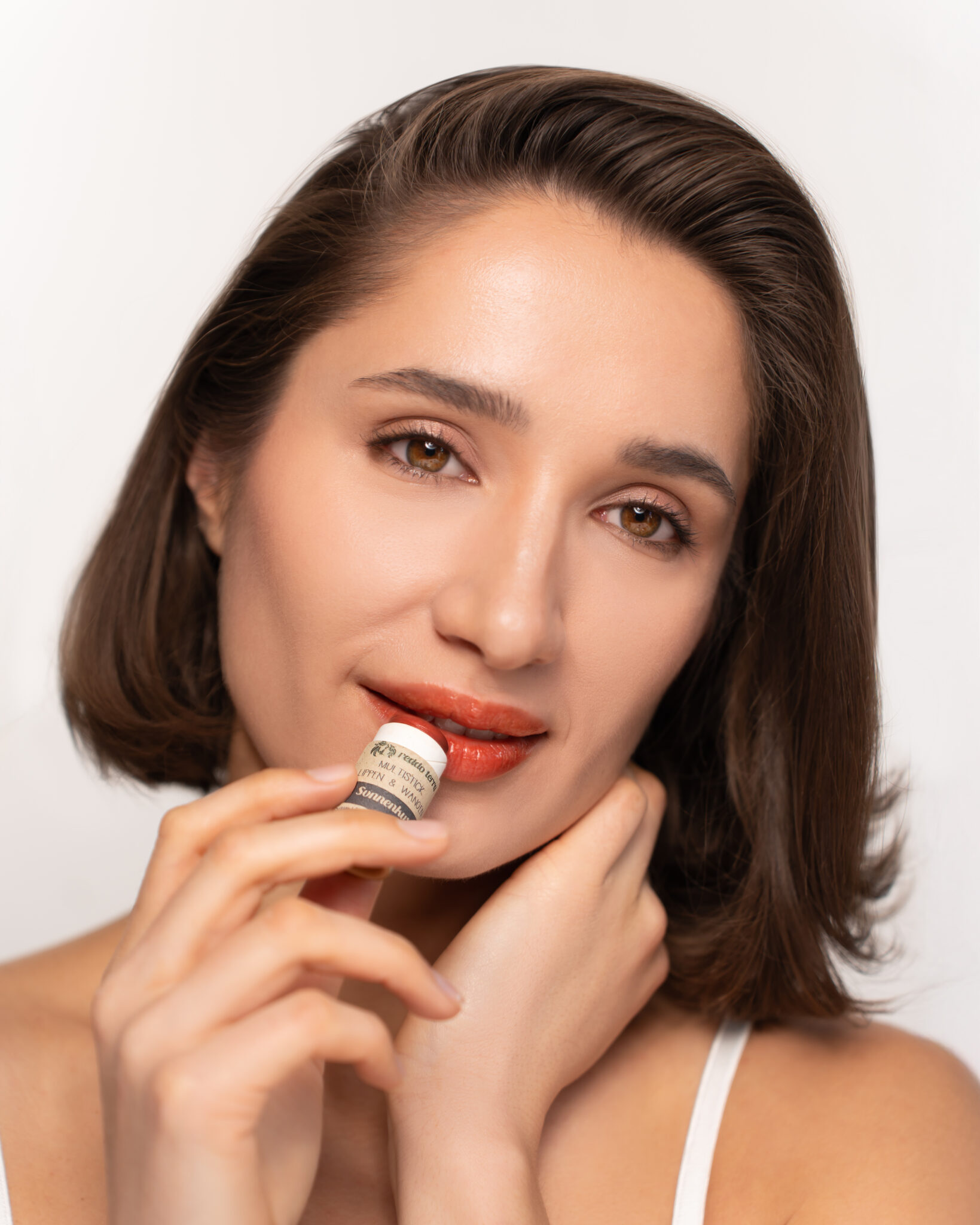 Sonnenkuss Multistick Swatch auf Haut – warmes Pfirsich-Nude